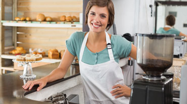 Smiling woman bakery owner